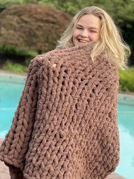 Emily Blair with one of her handmade blankets.